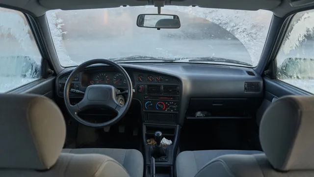 Car dashboard showing a normal engine temperature reading with the cabin heat turned up