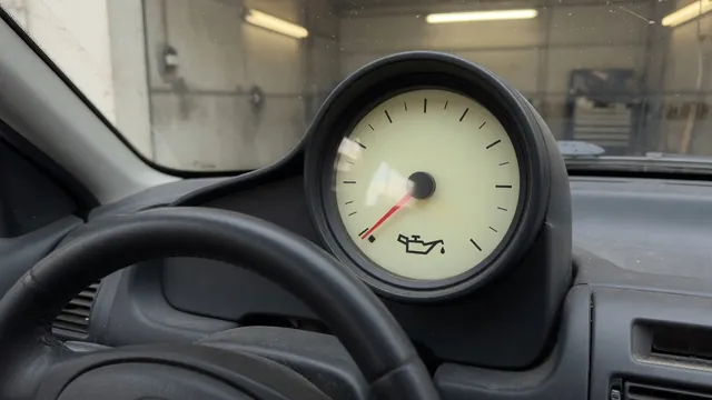 Dashboard oil pressure gauge with its needle resting at the low end of the scale