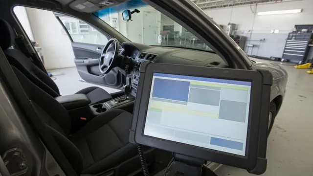 Diagnostic scanner beside a vehicle dashboard during a trouble code check