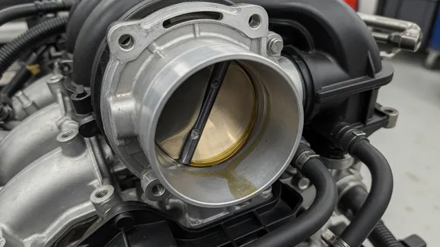 Light oil residue along the inside of an automotive throttle body beside the throttle plate
