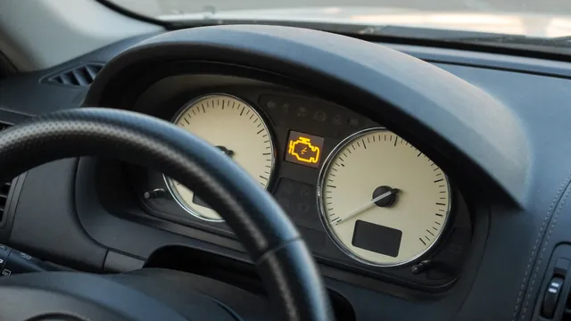 Car dashboard showing a check engine warning with a tachometer during an engine diagnostic inspection