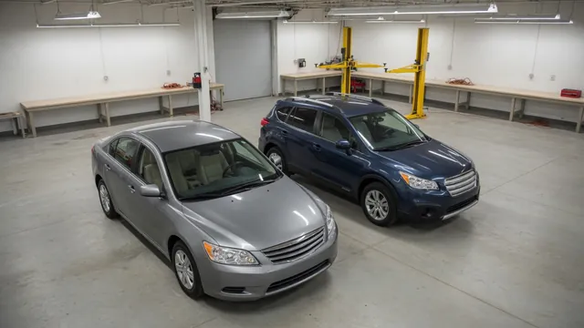 Chrysler 300 and Dodge Charger sedans parked in an automotive service bay