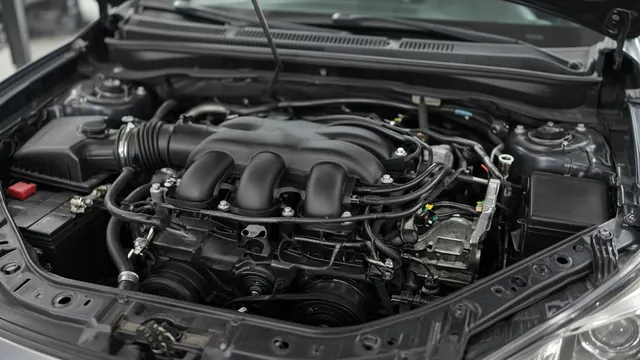 Engine bay showing intake manifold and vacuum hoses that can be inspected for visible damage