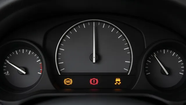 Dashboard with illuminated ABS, brake, and traction control warning indicators in a parked vehicle