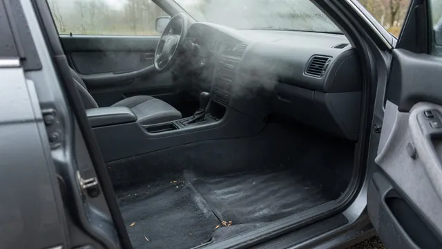Damp front passenger footwell and interior windshield haze suggesting a possible cabin coolant leak