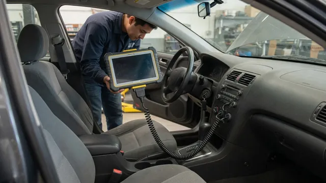 Diagnostic scan tool connected inside a parked vehicle during a fault code check