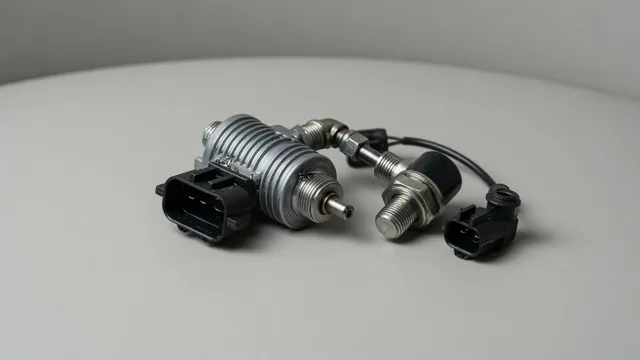 Illustration of a Honda VTEC oil pressure switch and oil control solenoid assembly