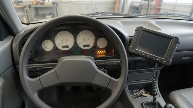 Diesel instrument cluster showing an illuminated glow plug indicator with a diagnostic scanner nearby
