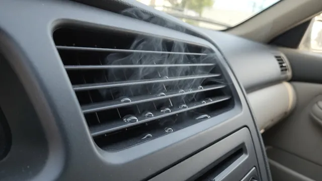 Light mist emerging from a car dashboard air vent with small moisture droplets on the louvers