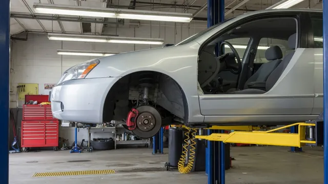 Ford Escape wheel hub and bearing area shown with the wheel removed in a professional service bay
