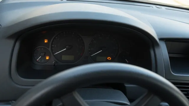 Dashboard showing a low fuel warning and illuminated check engine light