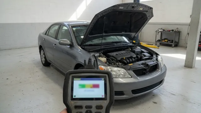 Engine bay with an OBD-II scanner displaying the P0304 cylinder 4 misfire code