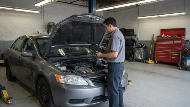 Parked car with its hood open while a technician checks engine diagnostic data