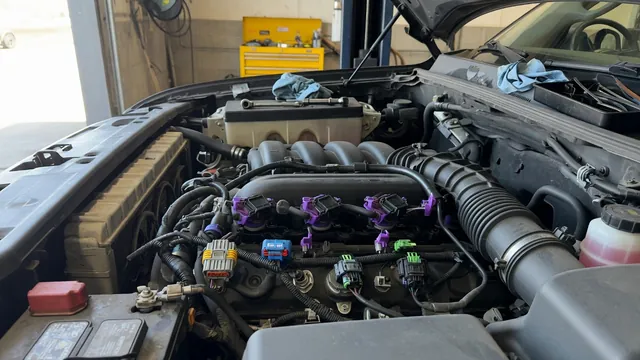 Ram 1500 engine bay illustration highlighting ignition coils and their electrical connectors