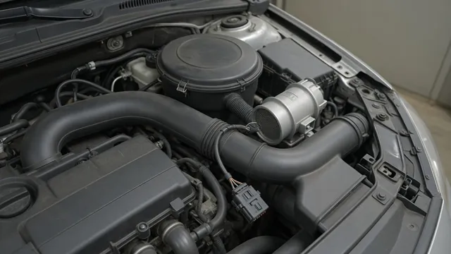 Illustration of an intake air duct with a mass air flow sensor and electrical connector