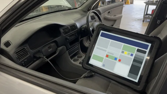 Diagnostic scanner beside a vehicle dashboard displaying the P1507 trouble code