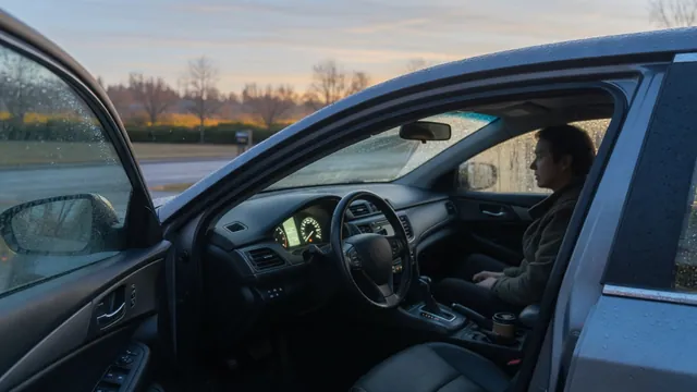 Driver checking the dashboard while parked after noticing shaking at engine startup