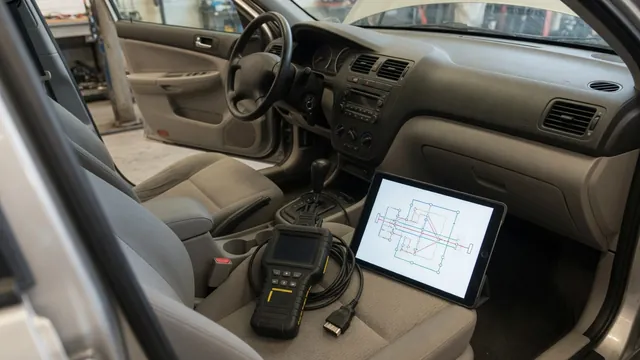 Diagnostic scan tool beside a vehicle dashboard with a control module and wiring diagram