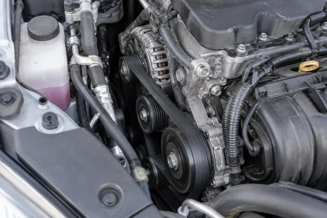 Toyota Camry accessory belt and pulleys with the engine off during a visual inspection