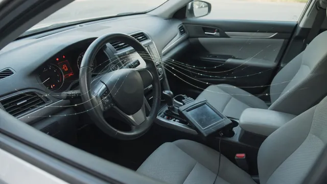 Dashboard steering and stability-control warning symbols beside a diagnostic scan tool