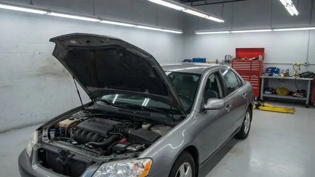 Honda Civic parked in a service bay for a charging system inspection