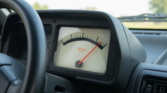Dashboard oil pressure gauge showing a needle near the upper end of its scale