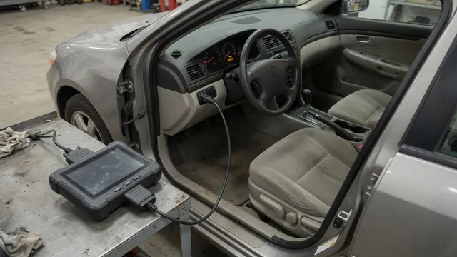 Diagnostic scanner beside a vehicle dashboard with the check engine light illuminated