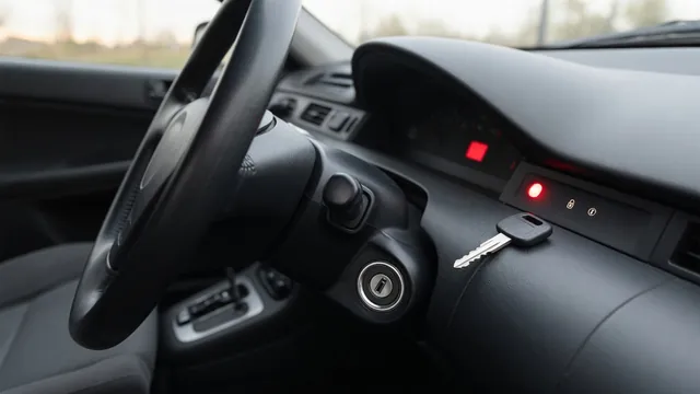 Car key beside an ignition cylinder with an illuminated security indicator on the dashboard