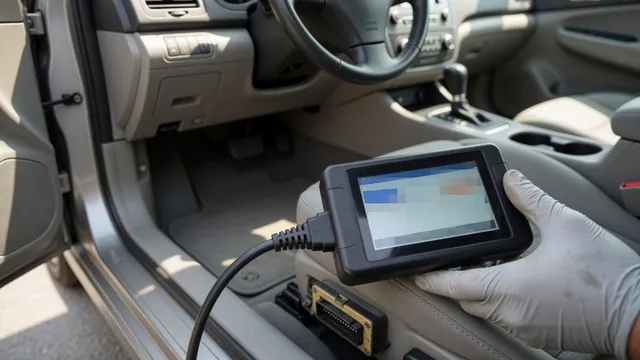 Handheld OBD-II scanner plugged into a car's diagnostic port under the dashboard to read a trouble code