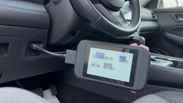 OBD-II scan tool connected under a car dashboard showing a network communication trouble code