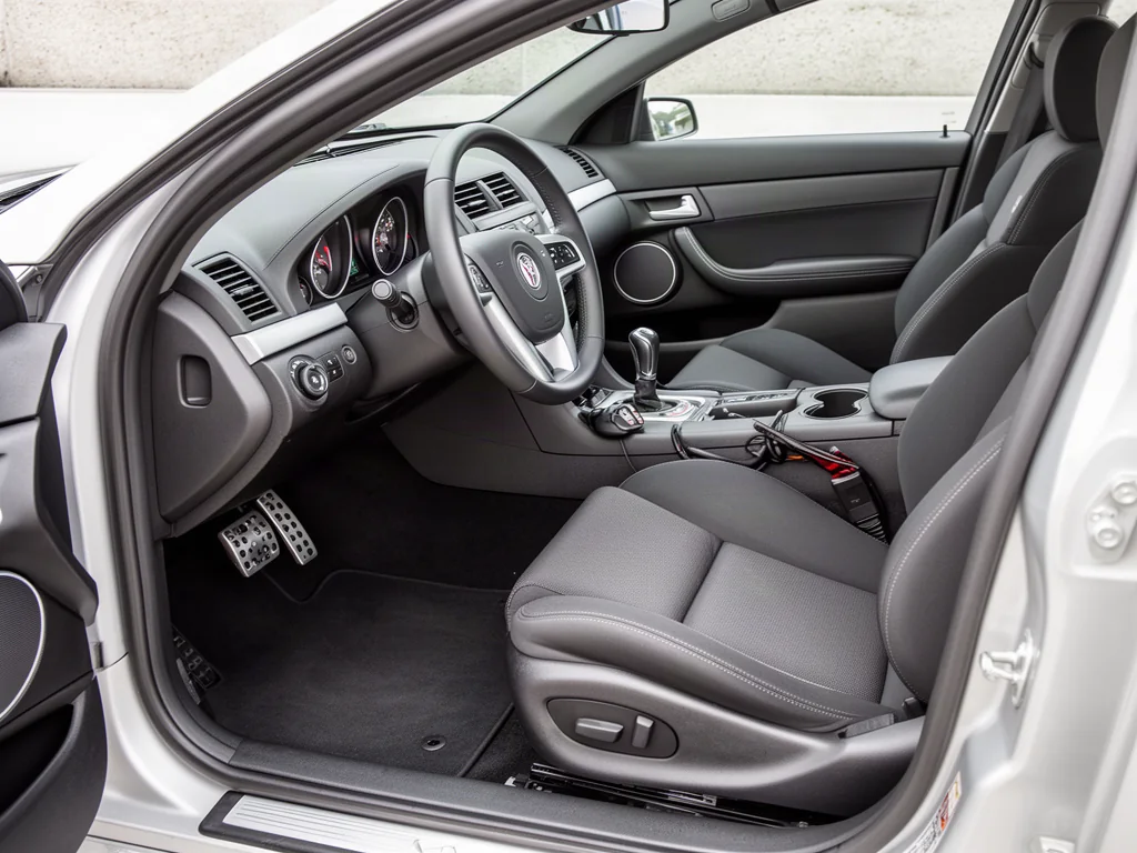 Pontiac G8 GXP interior showing the six-speed manual shifter and three pedals