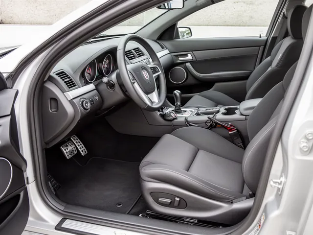 Pontiac G8 GXP interior showing the six-speed manual shifter and three pedals