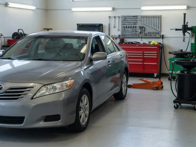 Toyota Camry parked in a clean service bay for transmission fluid maintenance